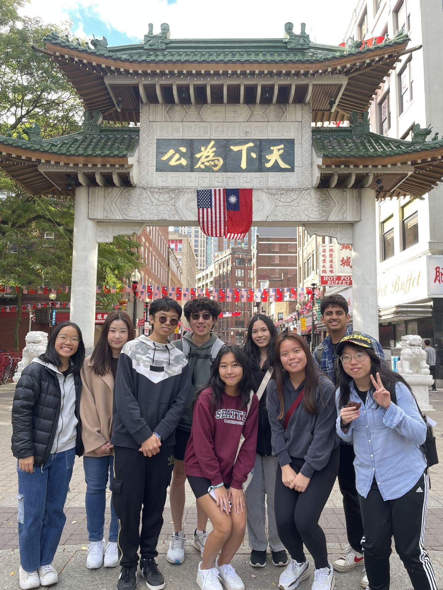 Nine SASE GT members posing under the Chinatown gate on a chapter trip.
